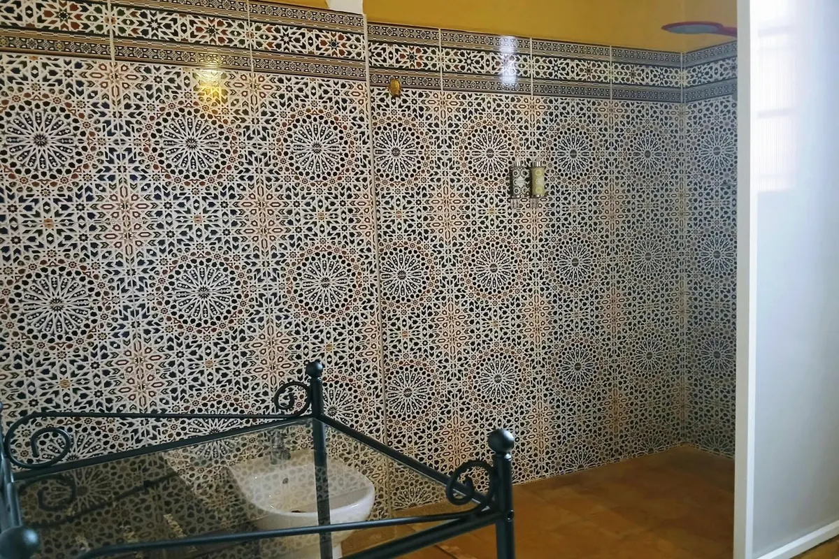 Al Mansour bathroom walls covered in zellige